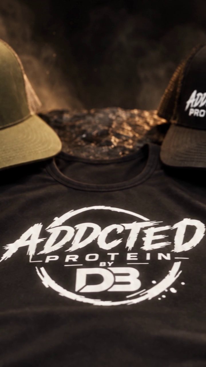 Black tank with circular ADDCTED PROTEIN BY DB emblem